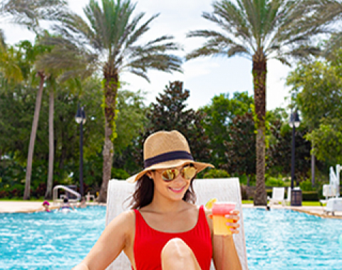 Woman relaxing by the pool